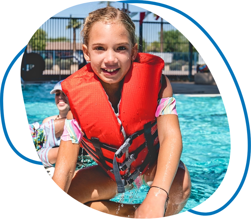girl in front of swimming pool with life vest