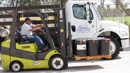 Worker using a forklift