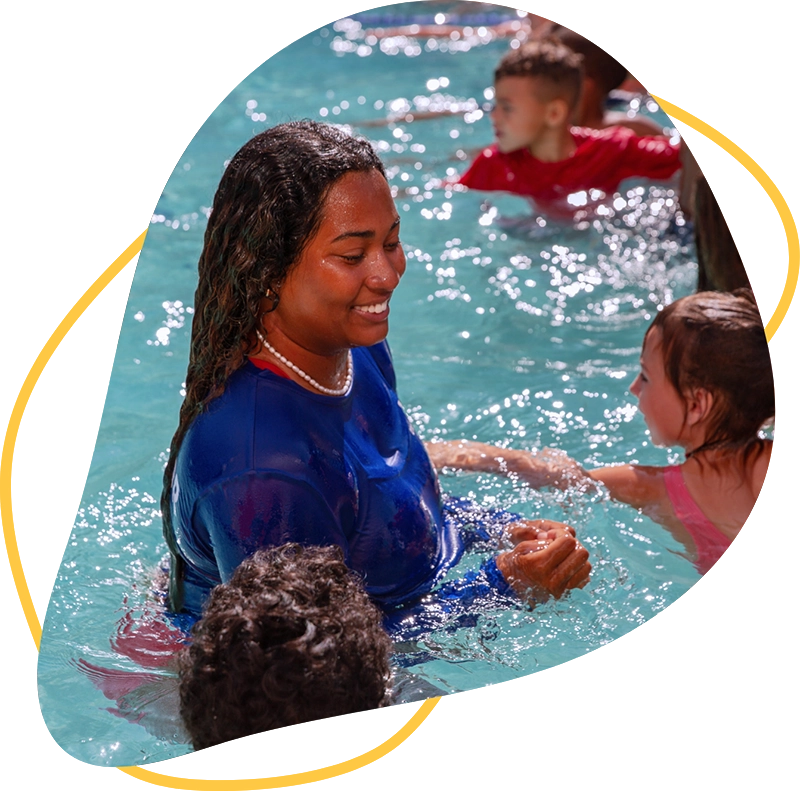 Woman teaching kids how to swim